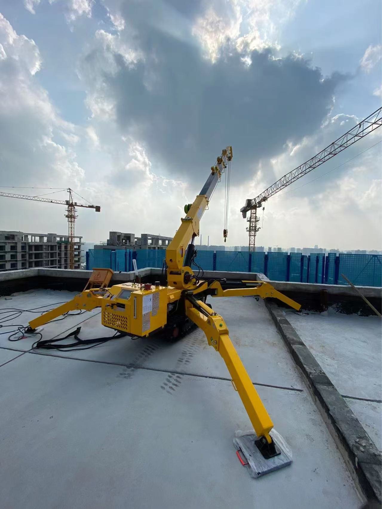 Proper outrigger pad deployment on firm ground for compact crawler crane stability